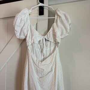 Kittenish white cut out mini dress